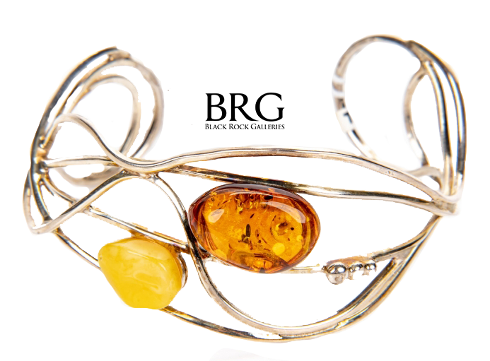 Cuff bracelets are rigid with an opening allowing the wearer to slip the bracelet onto the wrist like this Sterling Silver And Amber Cuff Bracelet